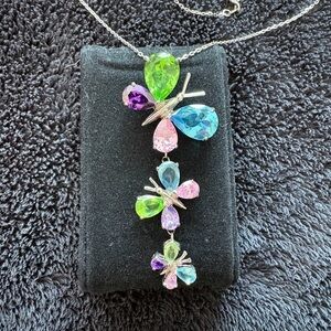 Sterling Silver Butterfly Necklace.
Pink, Purple, Blue and Green Stones.